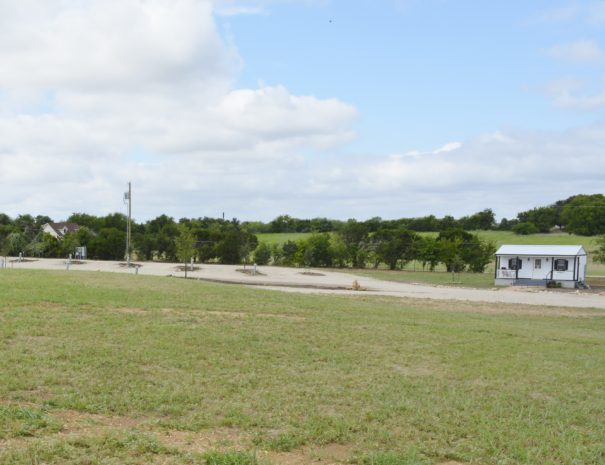 RV sites next to small white building